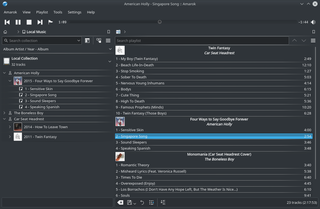 Amarok with the Breeze Dark theme, playing locally-stored albums